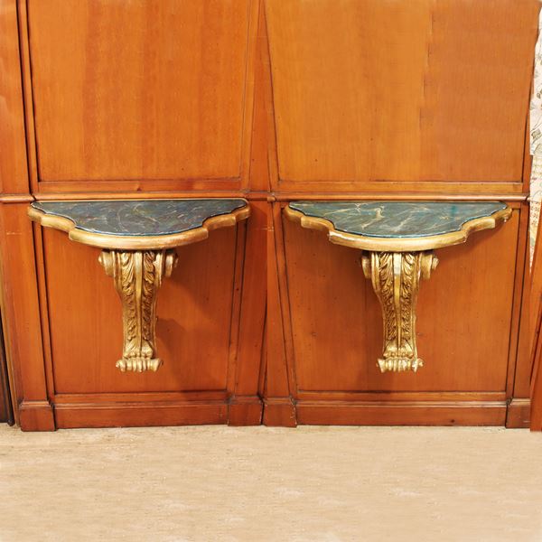 ♦ Coppia di consolles in legno laccato e dorato