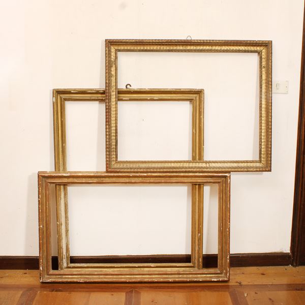 Tre cornici in legno dorato