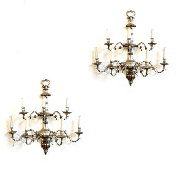 Coppia di appliques a sette luci in metallo argentato