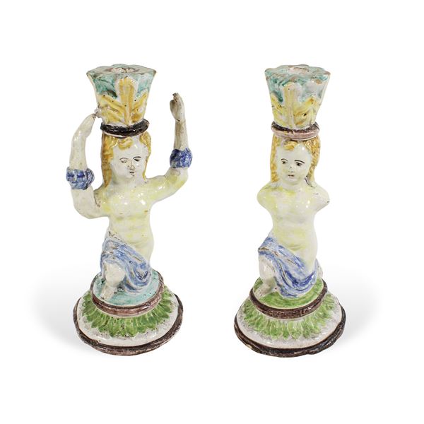 Coppia di candelieri in ceramica