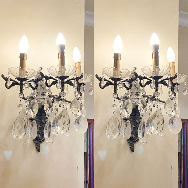 Coppia di appliques a tre luci