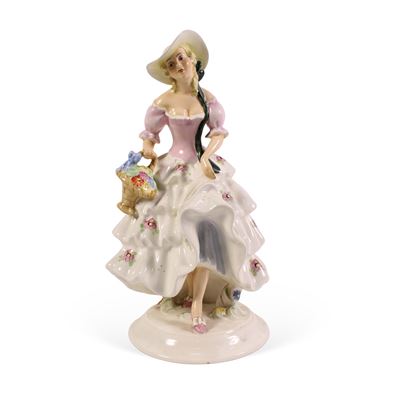 Manifattura Royal Dux, Scultura in porcellana raffigurante donna con cestino