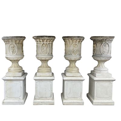 Vasi in pietra composta, Quattro vasi decorati con motivi vegetali e putti rappresentanti le quat...