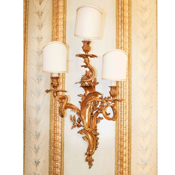 Sette appliques in bronzo dorato