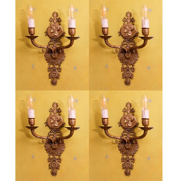 Quattro appliques in bronzo dorato